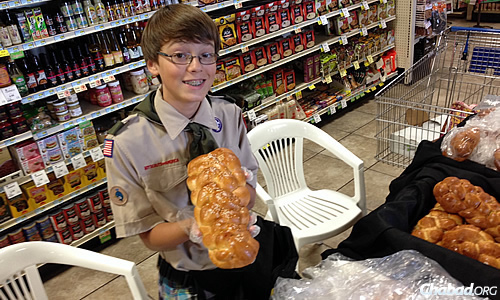 On Friday, the 13-year-old sold challahs at Toucan Market, a local store that donated ingredients for the loaves; he made and braided more than 100 with the help of family and friends.