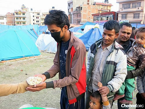The sheer joy on people's faces as they took the food was infectious, describes those close to the situation. (Photo: David Karsenty/Chabad of Nepal)