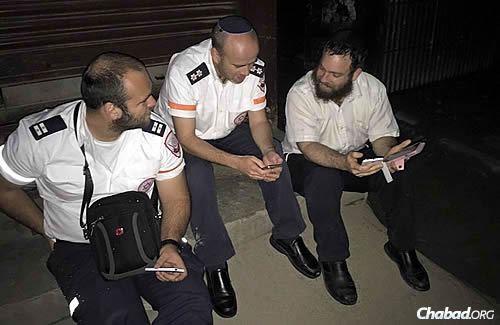 The rabbi with representatives of Magen David Adom—Israel's national emergency medical, disaster, ambulance and blood-bank service—who flew in from Israel to help.