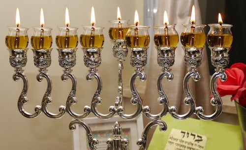 A Chanukah menorah on the eighth night, using oil.