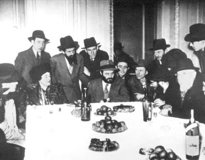 Paris, 1947. After the reunion of Rebbetzin Chana with her oldest son, a special reception was prepared with the participation of chassidim and friends. Here the future Rebbe farbrenged, his mother sitting to his right.